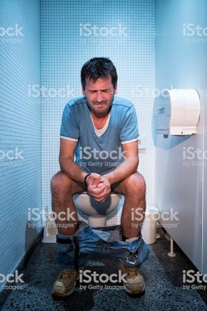man-sitting-in-public-restroom-picture-id523872779.jpg
